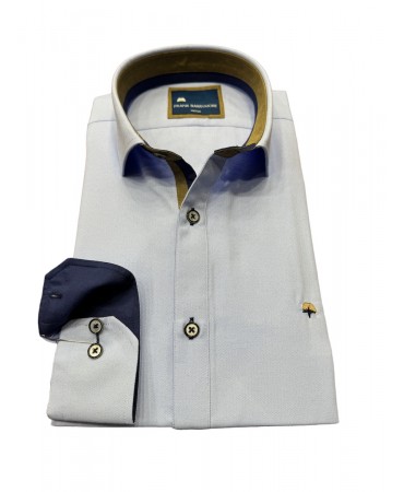 Light blue shirt with special finishes inside the collar and cuffs in beige color
