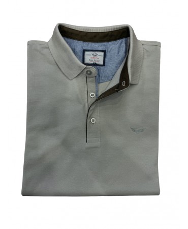 Beige polo shirt with a button in a comfortable line with brown trimmings inside the collar