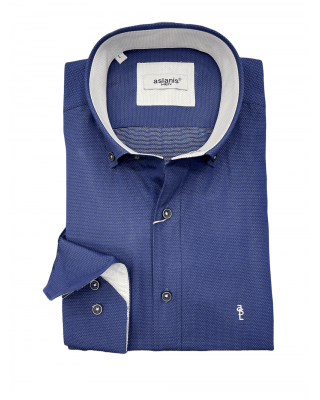 Shirt with white polka dots on a blue base and special white finishes for the Aslanis collar and cuff