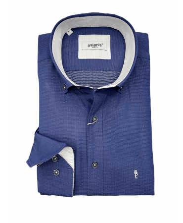 Shirt with white polka dots on a blue base and special white finishes for the Aslanis collar and cuff